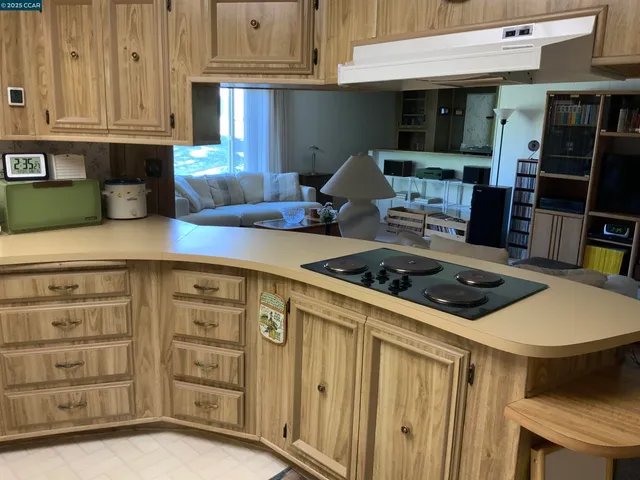 a kitchen with stainless steel appliances a refrigerator and a sink