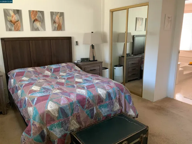 a bedroom with a bed and furniture