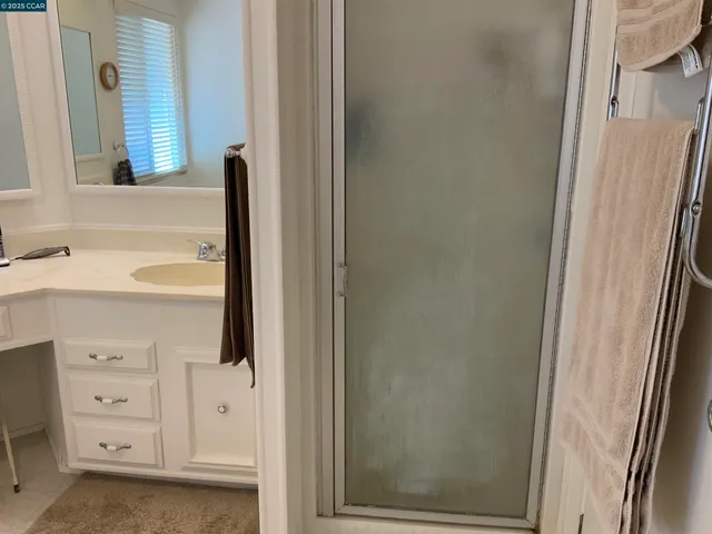 a kitchen with cabinets appliances and a counter