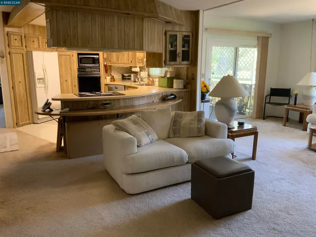 a view of an empty room with glass door