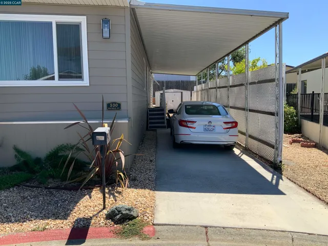a view of a patio with table and chairs with wooden floor