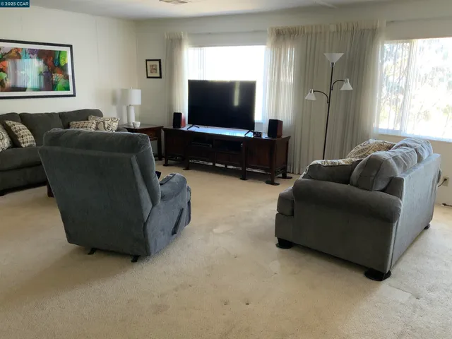 a living room with furniture and a window