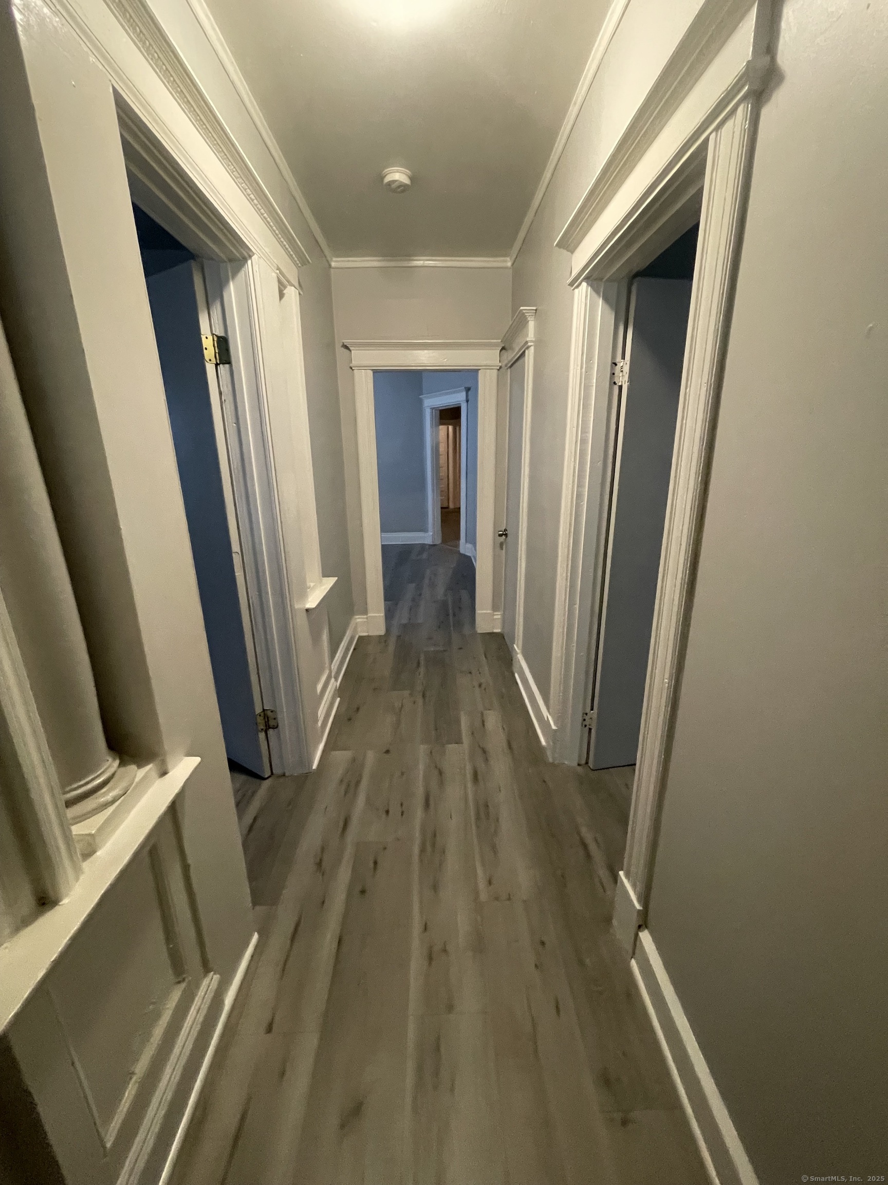 424 Edgewood Street, Unit 1 Hartford, CT 06112 - Photo 5 of 10 a view of a hallway with wooden floor and staircase