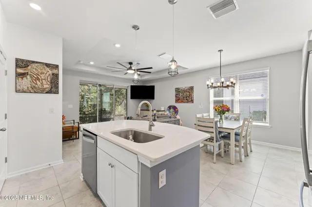 a kitchen with a sink stove and refrigerator