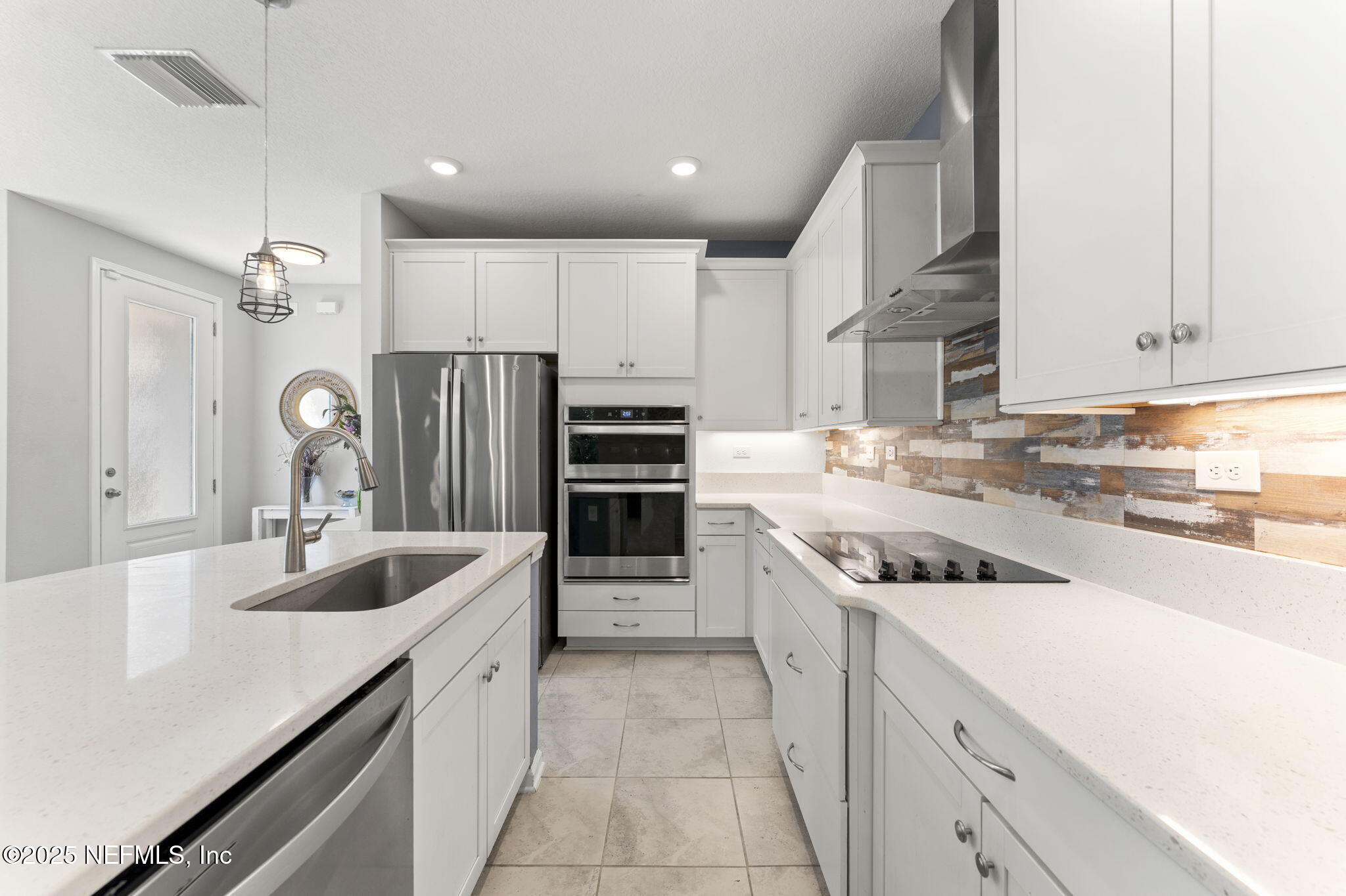 128 Modesto Drive St. Augustine, FL 32086 - Photo 15 of 30 a kitchen with a sink stove and refrigerator