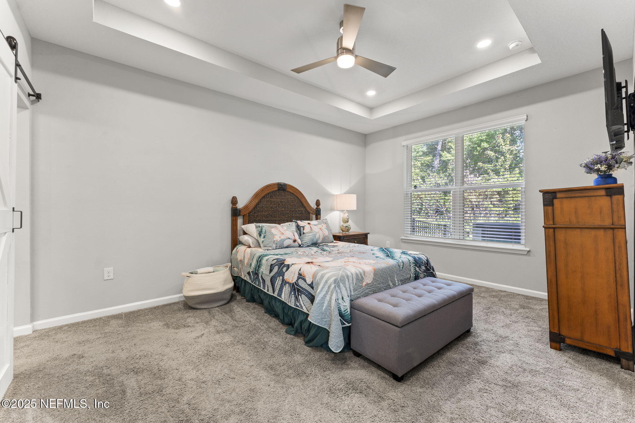 128 Modesto Drive St. Augustine, FL 32086 - Photo 19 of 30 a spacious bedroom with a bed and a window