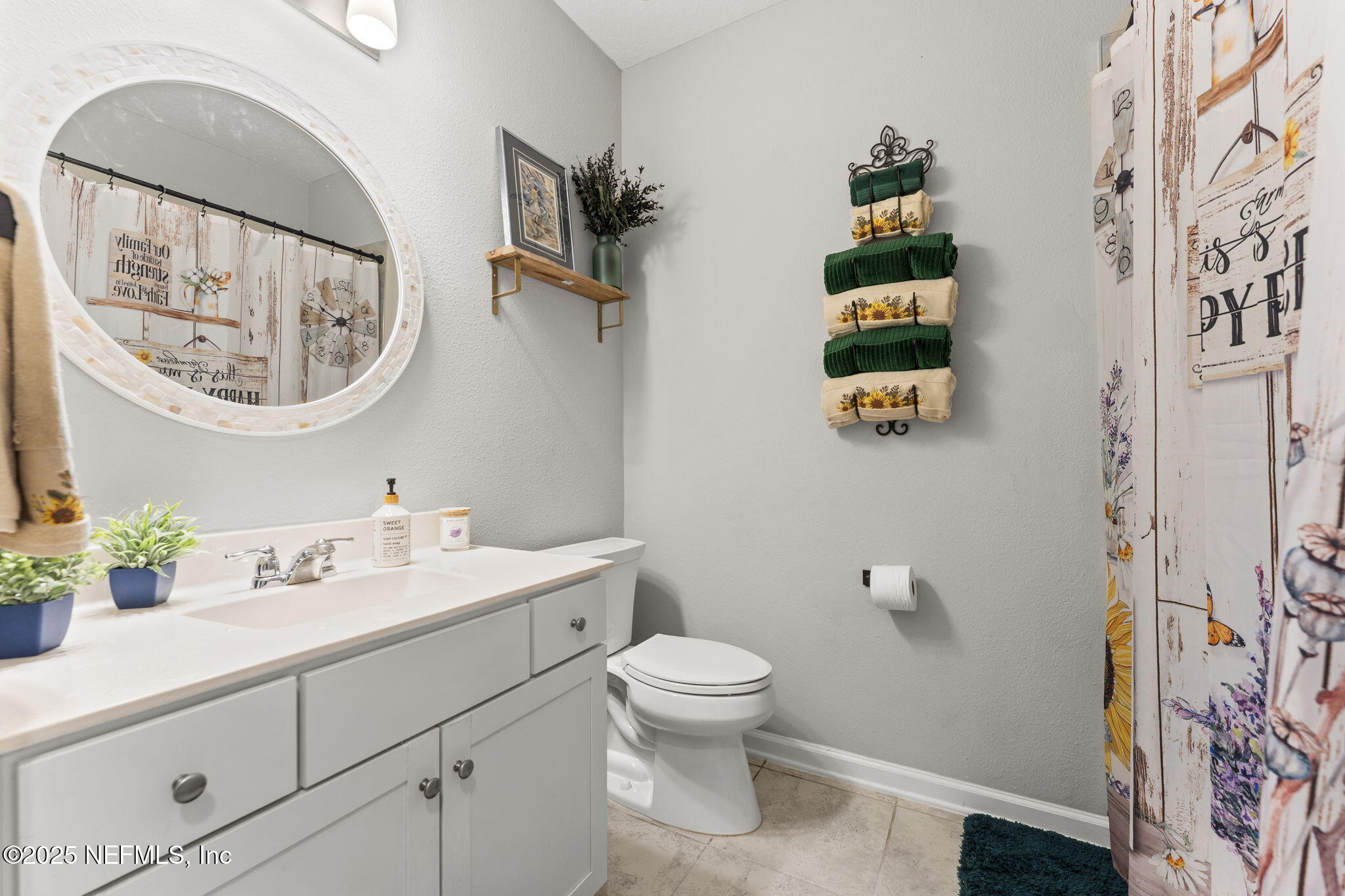 128 Modesto Drive St. Augustine, FL 32086 - Photo 21 of 30 a bathroom with a toilet a sink and a mirror