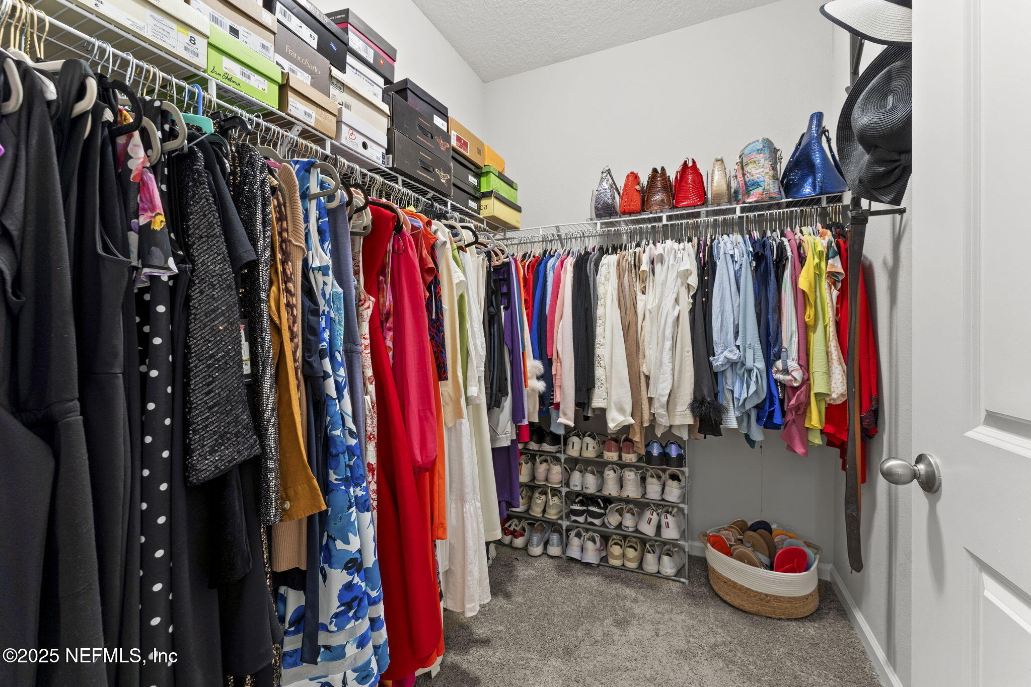 128 Modesto Drive St. Augustine, FL 32086 - Photo 24 of 30 a view of walk in closet with clothes