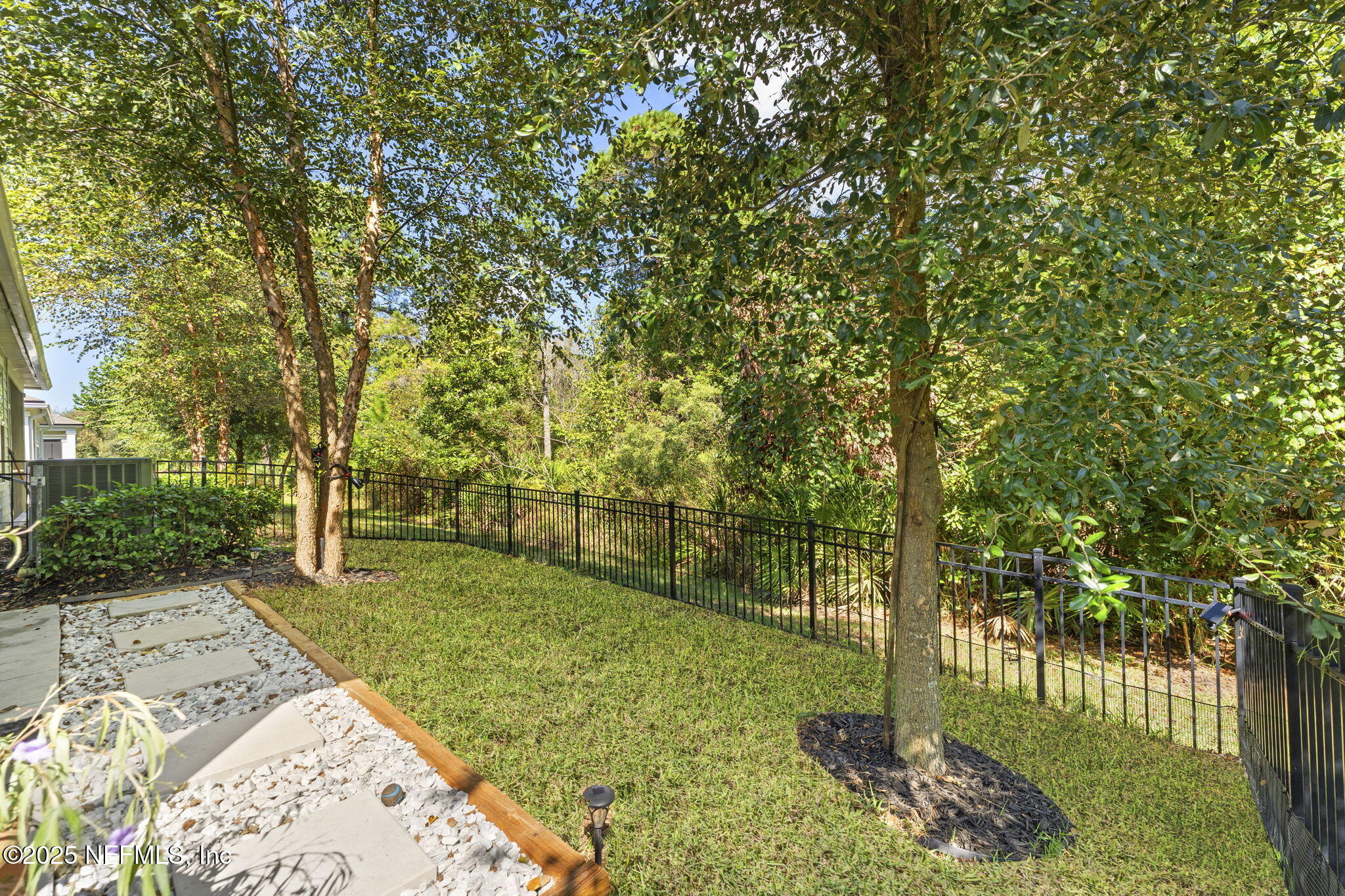 128 Modesto Drive St. Augustine, FL 32086 - Photo 30 of 30 a view of a yard with plants and trees