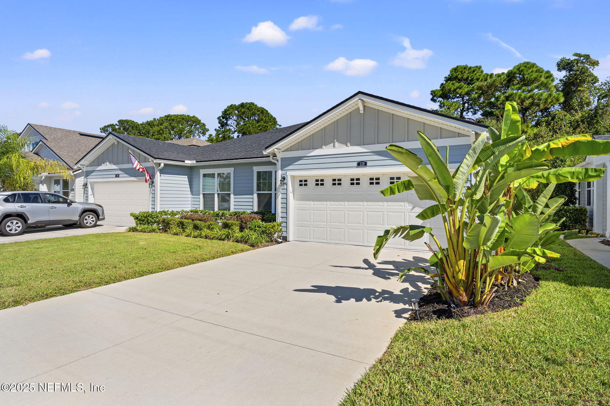 128 Modesto Drive St. Augustine, FL 32086 - Photo 3 of 30 a front view of a house with a yard and garage