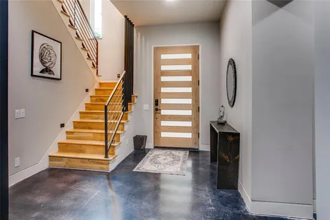 a view of entryway with stairs and wooden floor