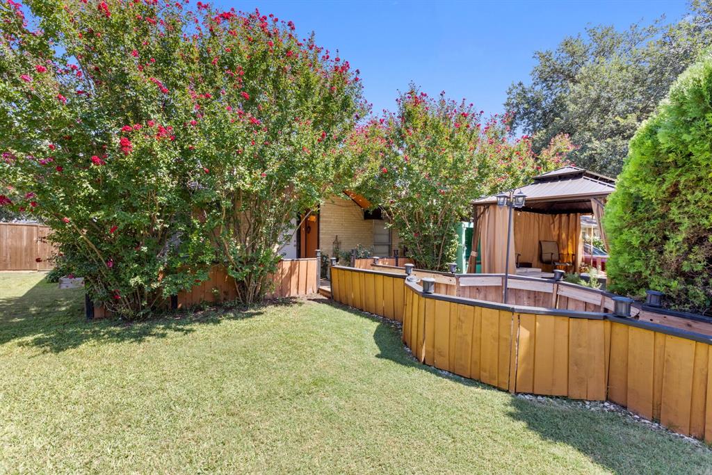 a view of a house with swimming pool and sitting area