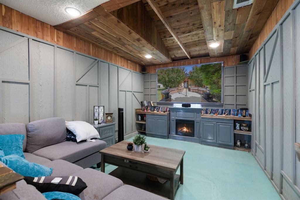 3352 Buckingham Lane Plano, TX 75074 - Photo 14 of 34 a living room with furniture and a fireplace