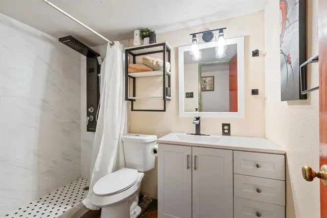 a living room with furniture fireplace and a window