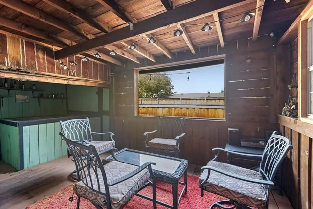 a view of balcony with furniture