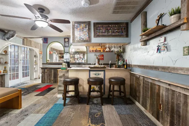 a kitchen with stainless steel appliances granite countertop a stove and cabinets