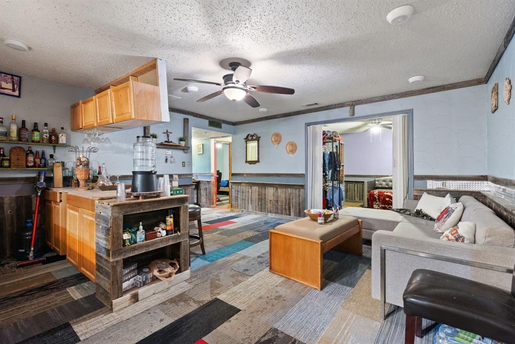 3352 Buckingham Lane Plano, TX 75074 - Photo 9 of 34 a living room with fireplace furniture and a large window