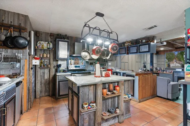 a kitchen with lots of counter top space and appliances