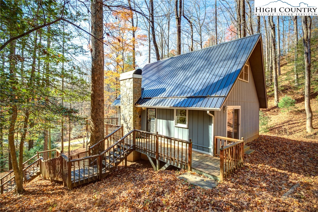 2143 Powder Horn Mountain Road Deep Gap, NC 28618 - Photo 4 of 37 a view of a house with a yard