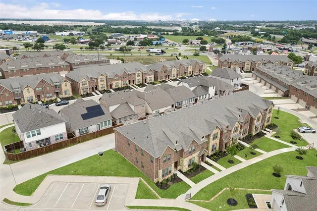 an aerial view of a house with a outdoor space
