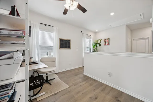 a view of a livingroom with furniture and a window