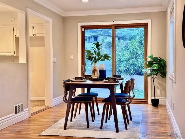 a spacious bedroom with a bed and a large window