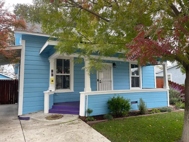 a front view of a house with garden