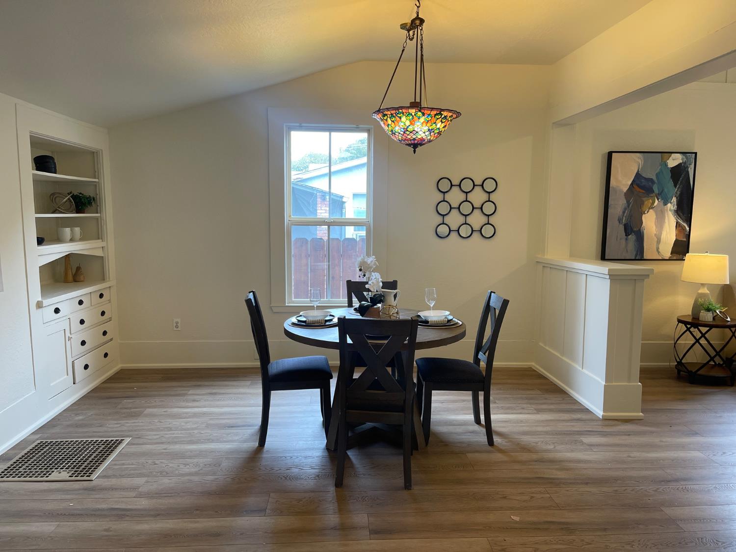 85 West 8th Street Tracy, CA 95376 - Photo 10 of 27 a view of a dining room with furniture window and wooden floor