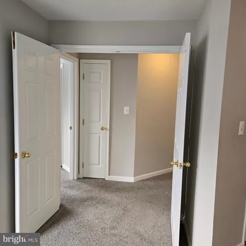 a view of empty room with floor to ceiling window