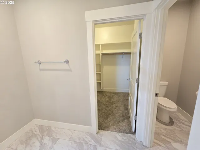 a bathroom with a toilet and a sink