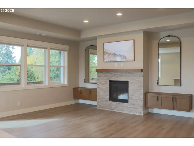 a living room with a fireplace and a window