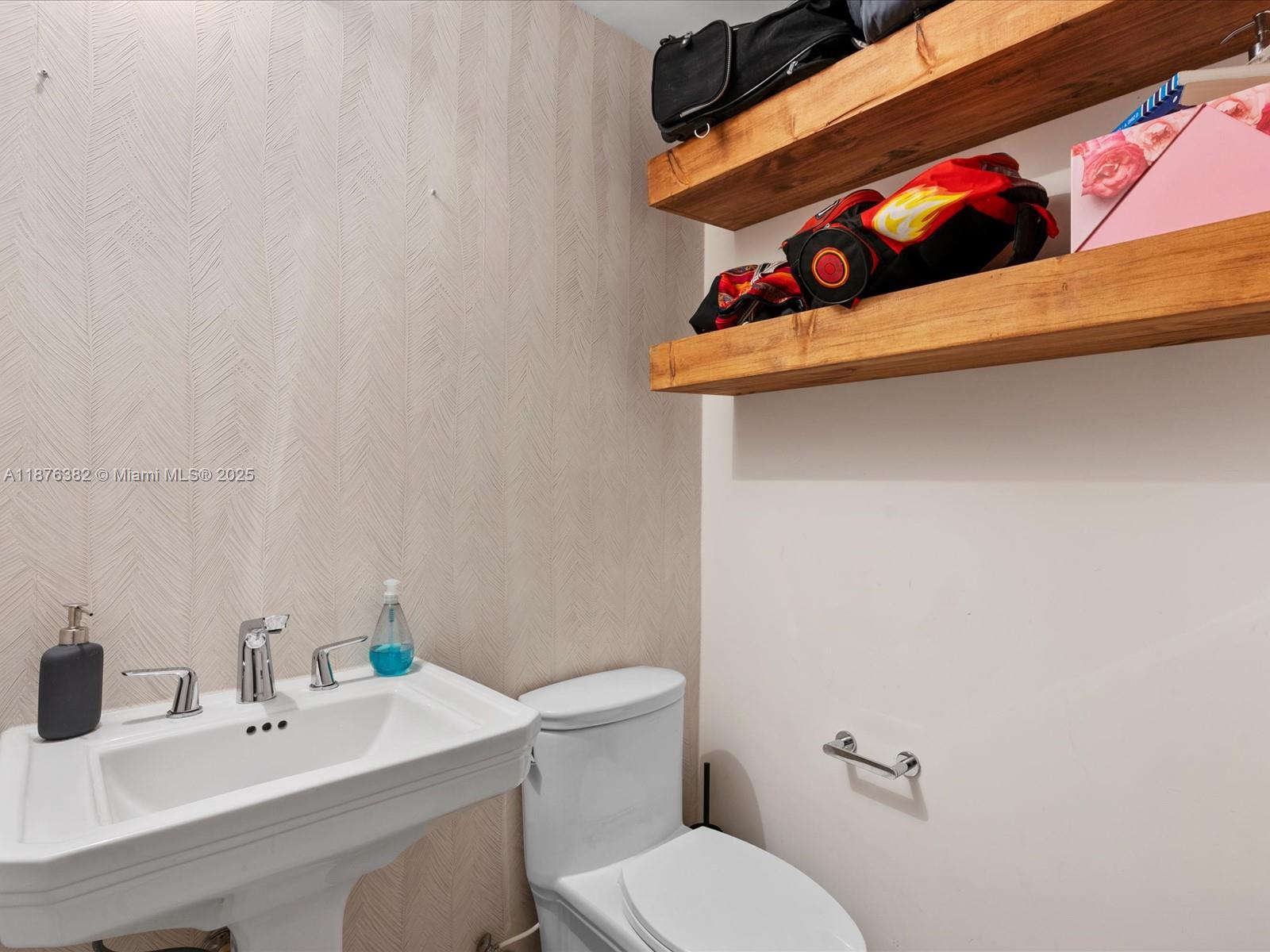 1010 Southwest 2nd Avenue, Unit 1908 Miami, FL 33130 - Photo 20 of 49 a bathroom with a sink and a toilet