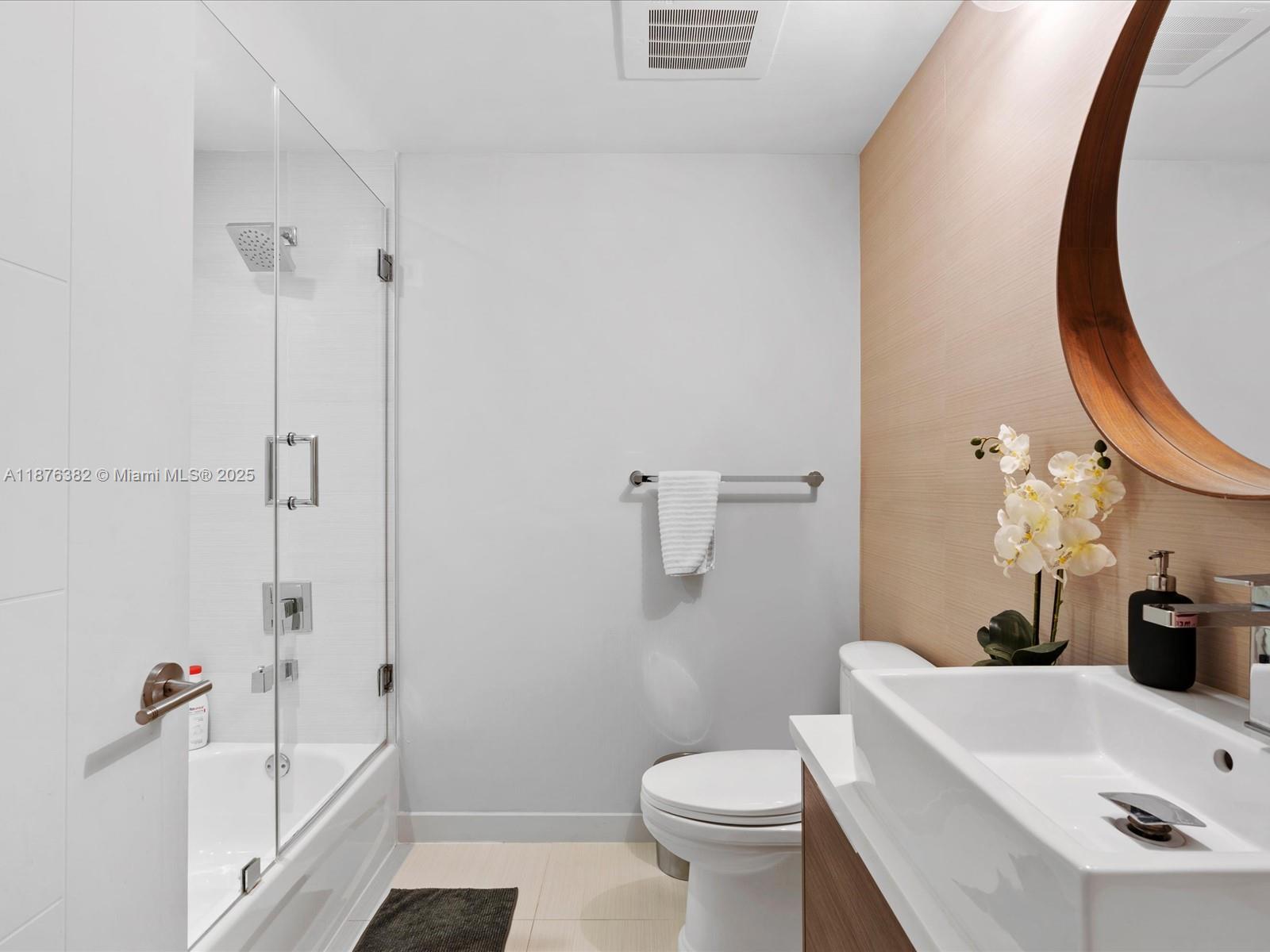 1010 Southwest 2nd Avenue, Unit 1908 Miami, FL 33130 - Photo 30 of 49 a bathroom with a sink and a mirror