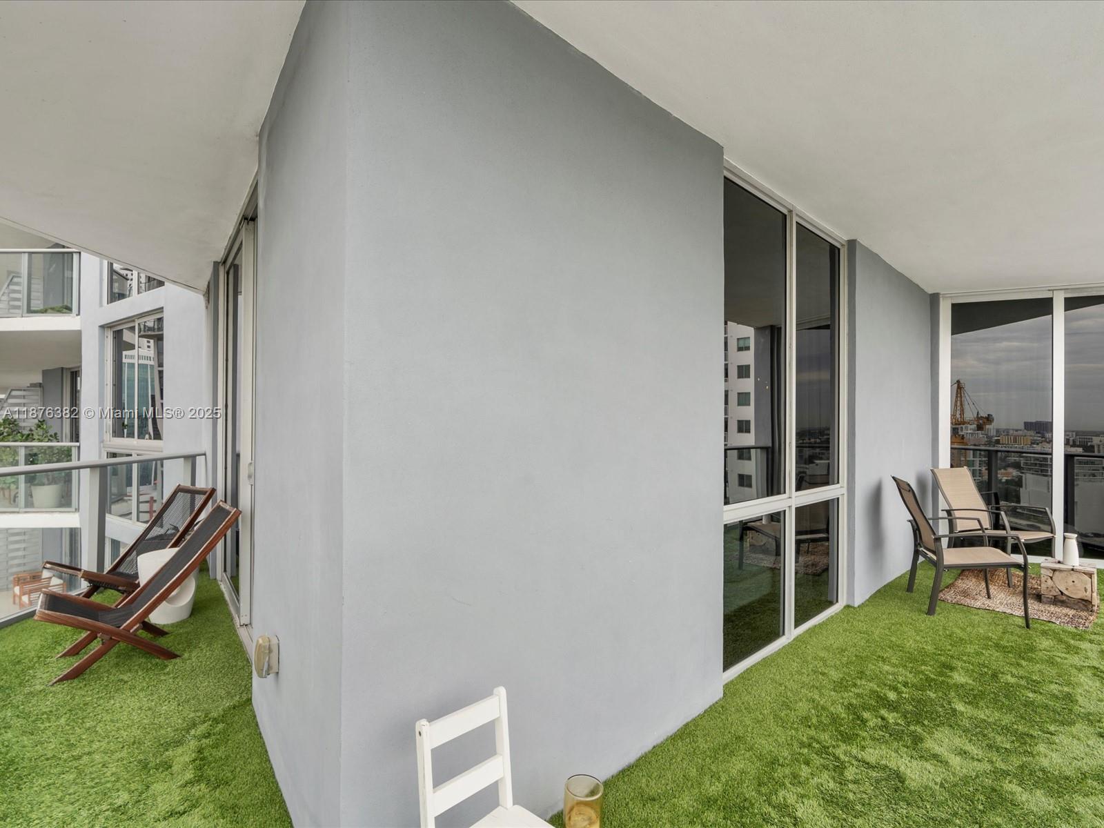 1010 Southwest 2nd Avenue, Unit 1908 Miami, FL 33130 - Photo 35 of 49 a view of a bedroom with furniture and garden