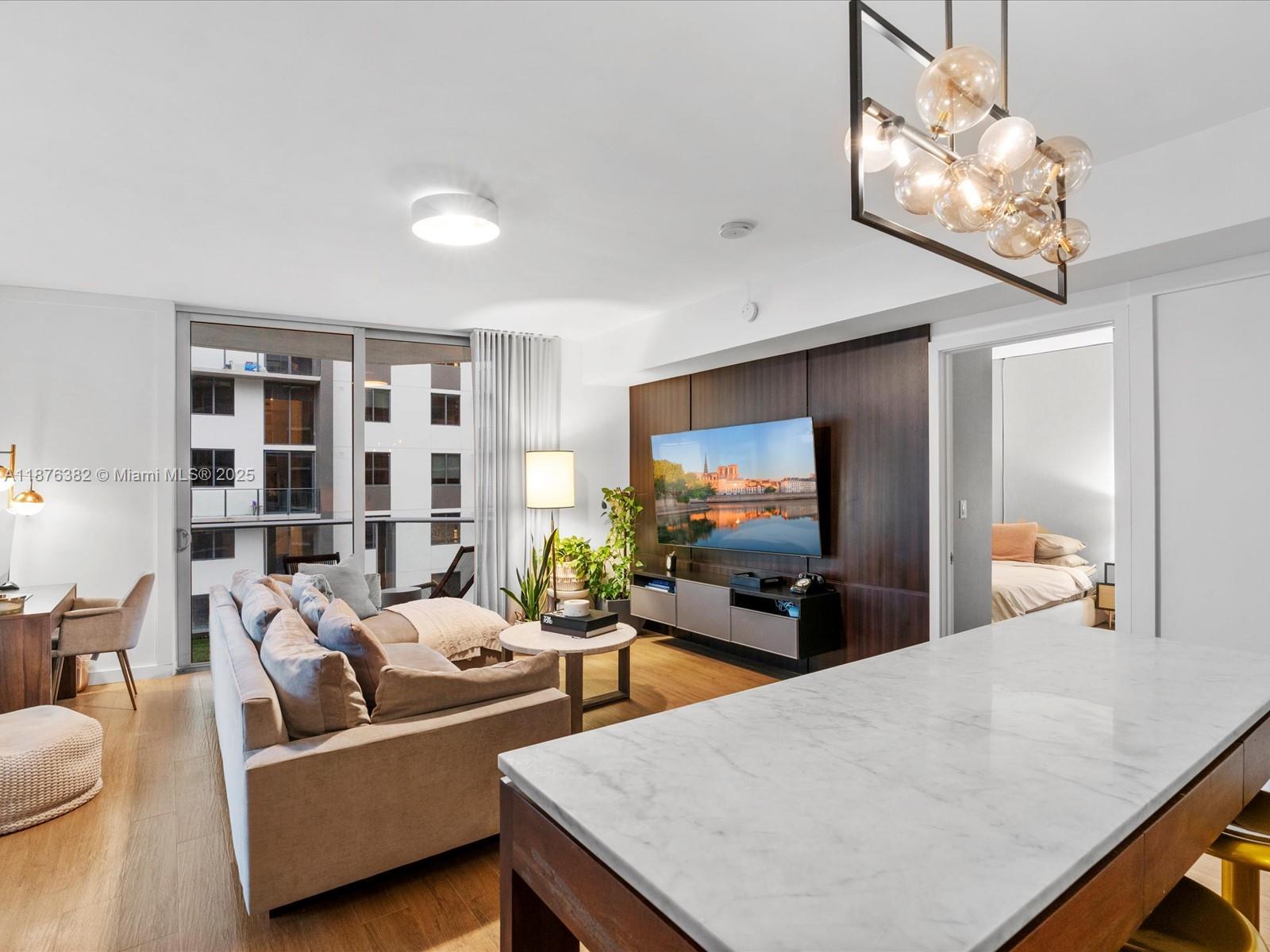 1010 Southwest 2nd Avenue, Unit 1908 Miami, FL 33130 - Photo 7 of 49 a living room with furniture and a flat screen tv