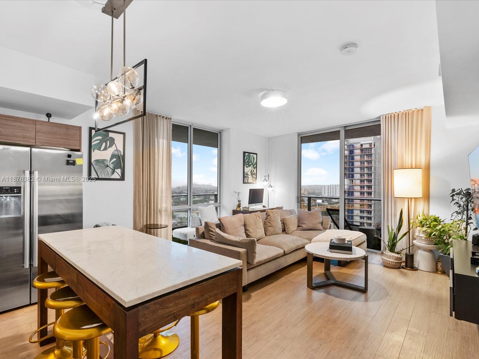 1010 Southwest 2nd Avenue, Unit 1908 Miami, FL 33130 - Photo 9 of 49 a living room with furniture and a large window