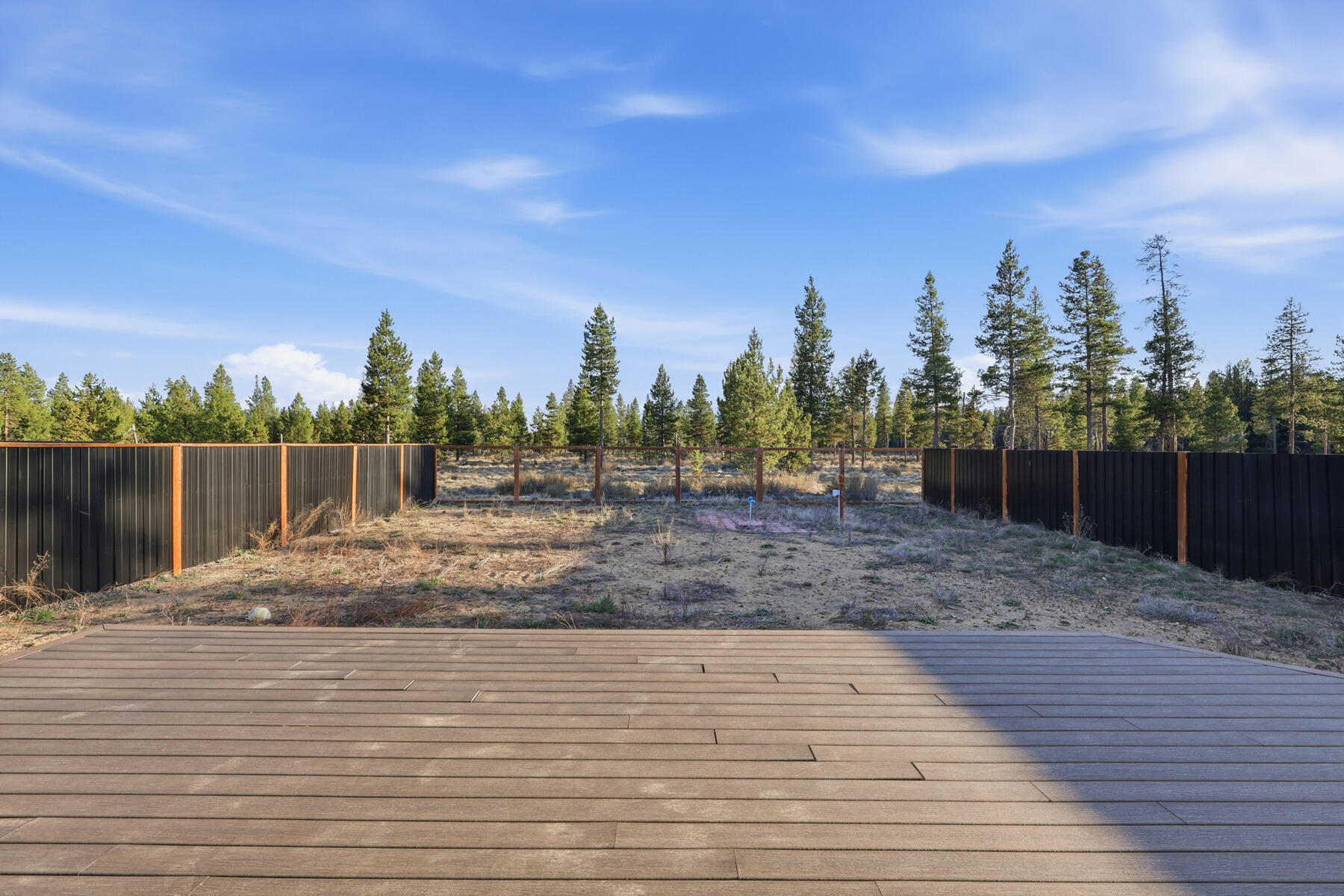 16455 Bassett Road La Pine, OR 97739 - Photo 23 of 44 a backyard of a house with lots of green space