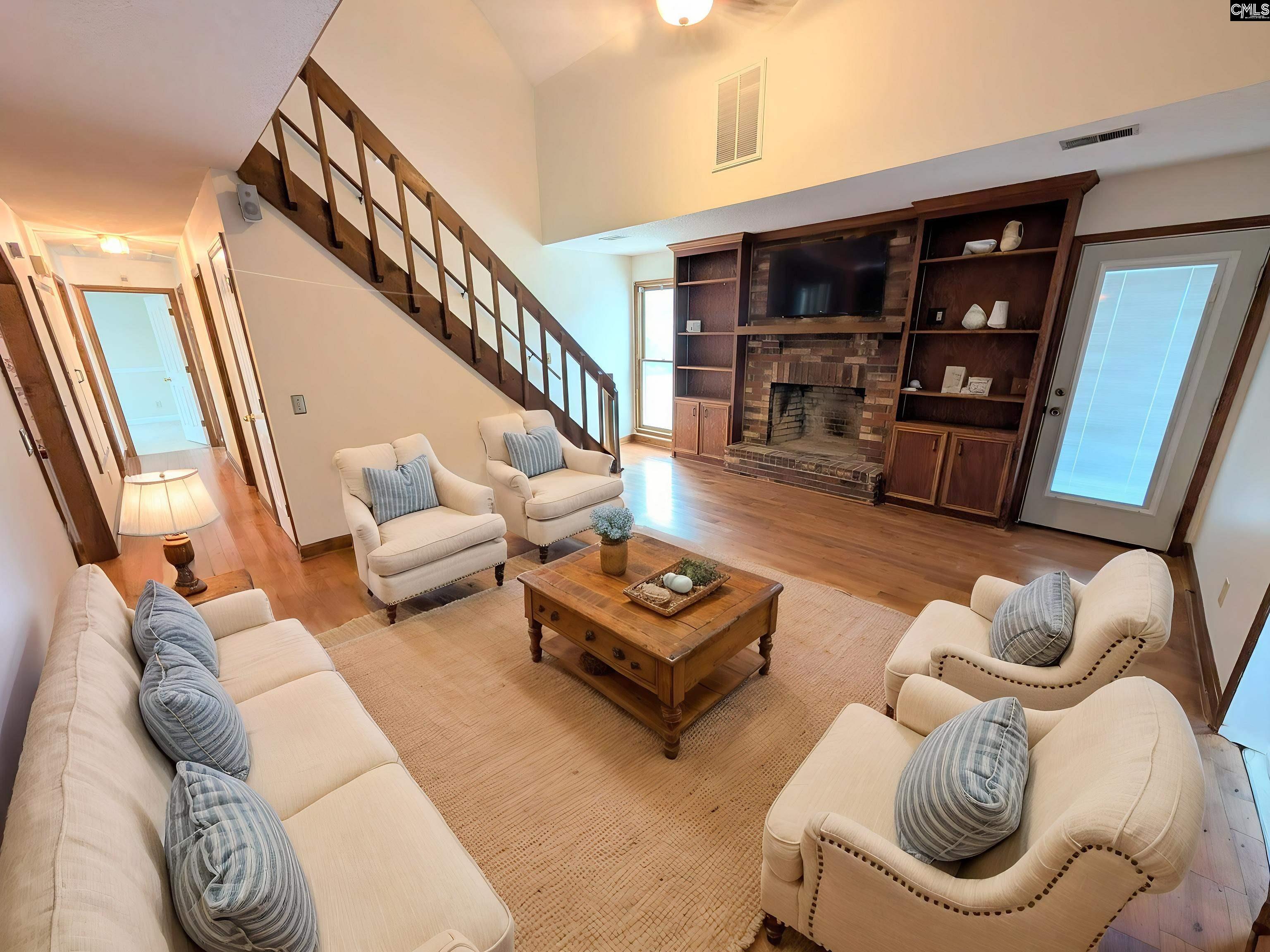100 Welsh Court Lexington, SC 29073 - Photo 5 of 27 a living room with furniture and wooden floor