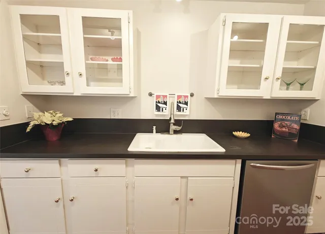 a kitchen with a sink and a window
