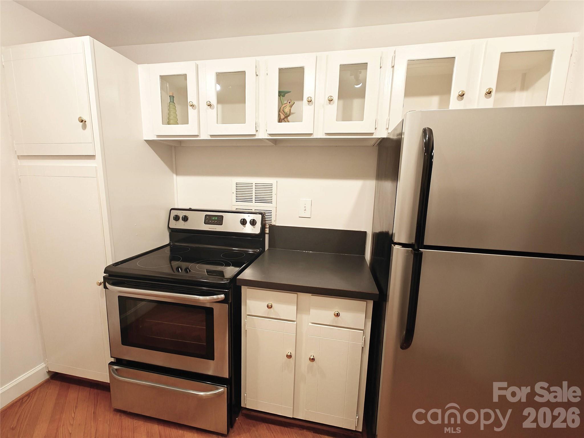 1323 Queens Road, Unit 321 Charlotte, NC 28207 - Photo 6 of 31 a utility room with dryer and washer
