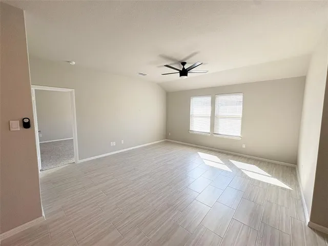 a large kitchen with stainless steel appliances a refrigerator and a stove top oven