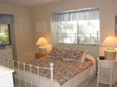 Undisclosed Address Brewster, MA 02631 - Photo 7 of 10 a bed sitting in a bedroom next to a window