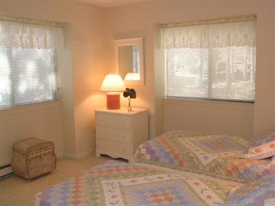 Undisclosed Address Brewster, MA 02631 - Photo 8 of 10 a bedroom with a bed and a window