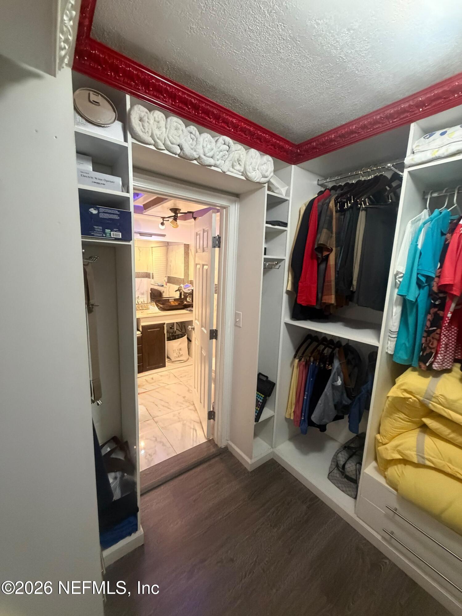 4127 Springwood Road Jacksonville, FL 32207 - Photo 29 of 63 a view of walk in closet with clothes and shoes