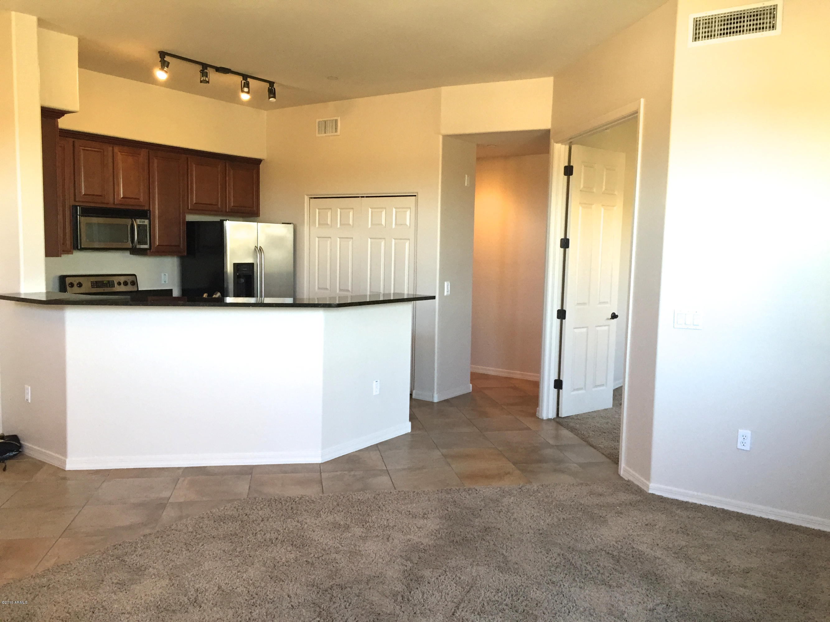 3330 South Gilbert Road, Unit 2038 Chandler, AZ 85286 - Photo 4 of 20 Living to Kitchen