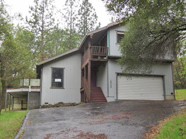 a front view of a house with a garage