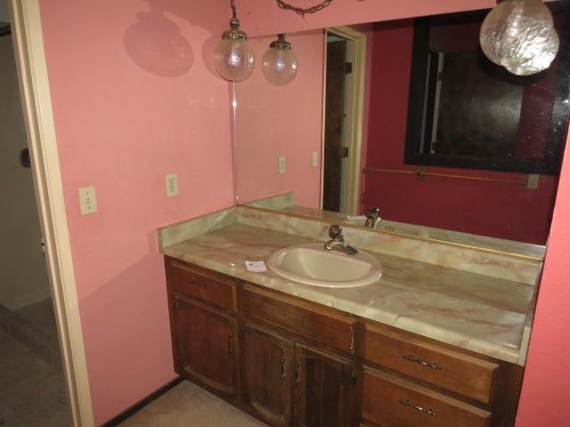 18750 Hilltop Road Penn Valley, CA 95946 - Photo 13 of 21 a bathroom with a sink and a mirror