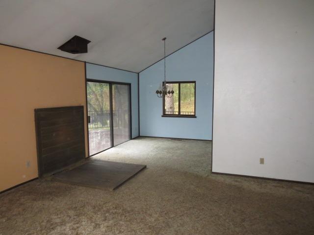 18750 Hilltop Road Penn Valley, CA 95946 - Photo 4 of 21 an empty room with windows and entrance