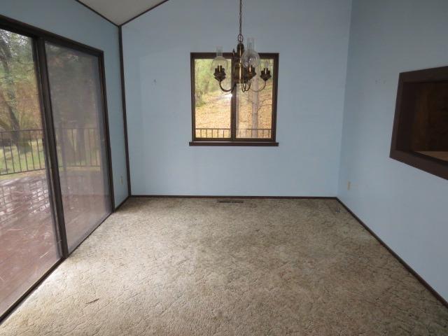 18750 Hilltop Road Penn Valley, CA 95946 - Photo 5 of 21 a view of an empty room with a window