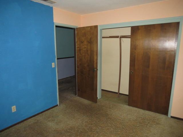 18750 Hilltop Road Penn Valley, CA 95946 - Photo 10 of 21 an empty room with closet and wooden floor